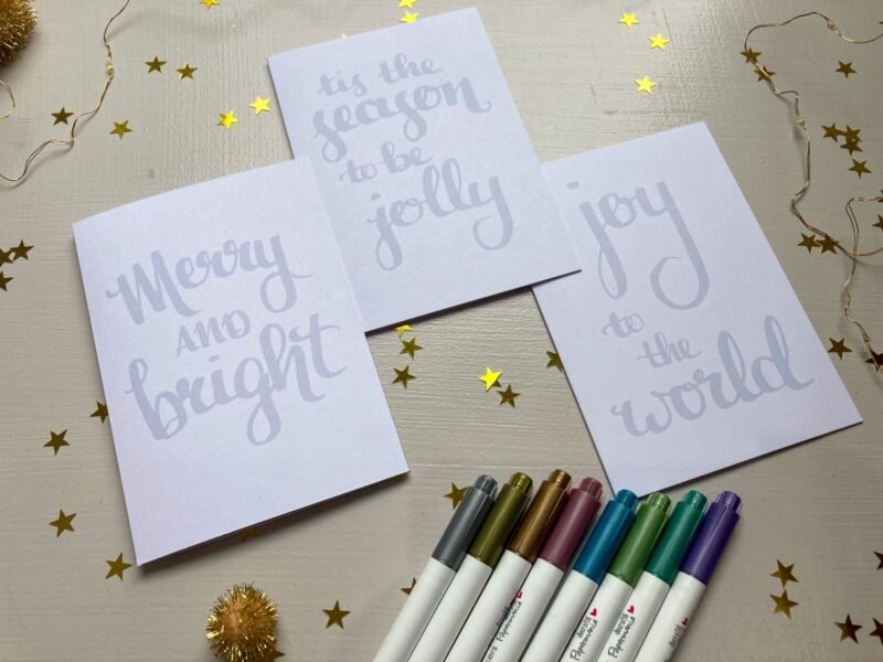 Christmas cards featuring the phrases - Merry and bright, joy to the world, tis the season to be jolly