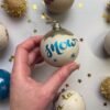 let it snow hand calligraphy bauble in blue and gold