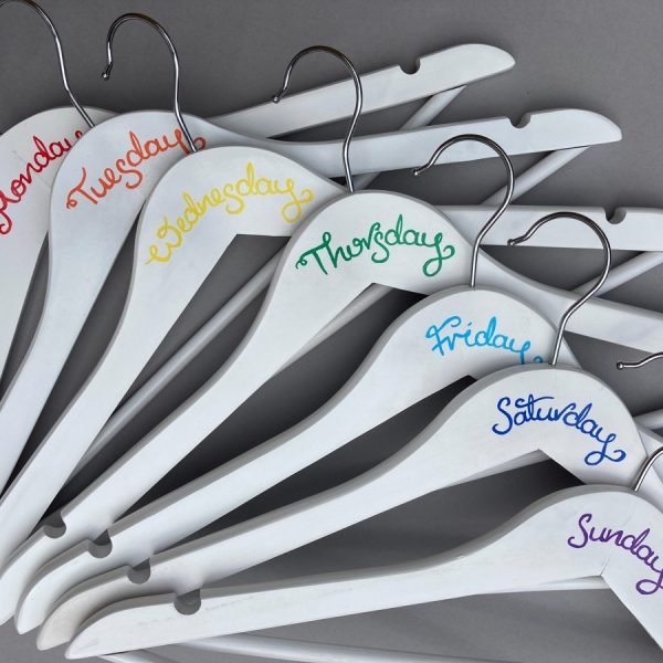 Close up view of day of week hanger writing in rainbow colourway