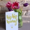 Hooray you've passed 5x7 card next to a vase of tulips