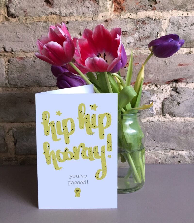 Hooray you've passed 5x7 card next to a vase of tulips