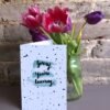 Sorry you're leaving 5x7 card next to a vase of tulips